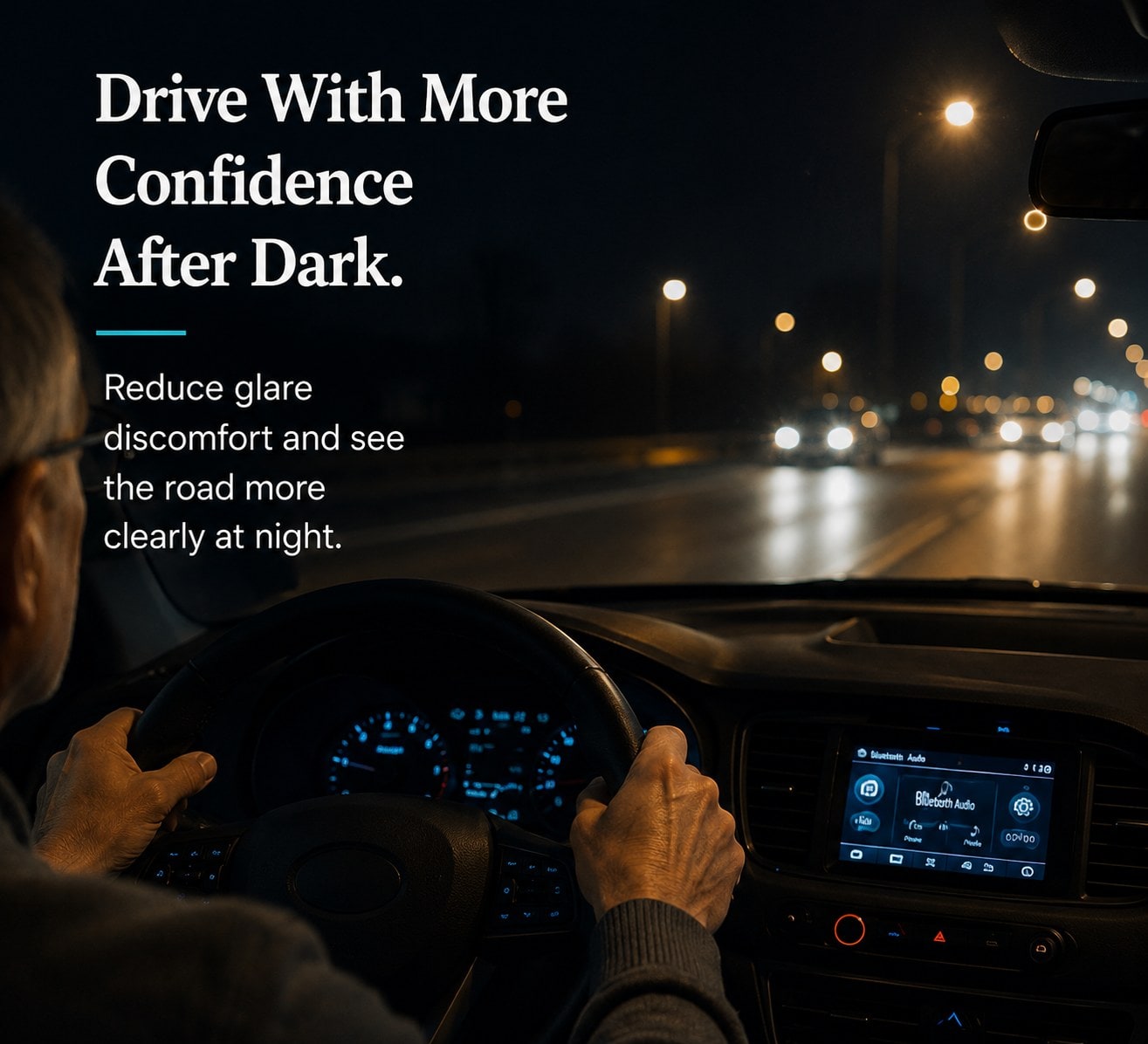 Drive with more confidence after dark. Reduce glare discomfort and see the road more clearly at night. A driver at the wheel on a lit road at night.